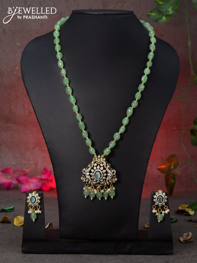 Beaded mint green necklace peacock design with sapphire & cz stones and beads hanging in victorian finish