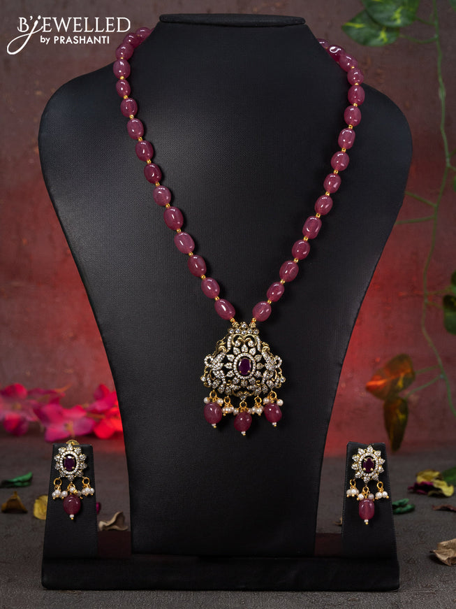 Beaded pink necklace peacock design with ruby & cz stones and beads hanging in victorian finish
