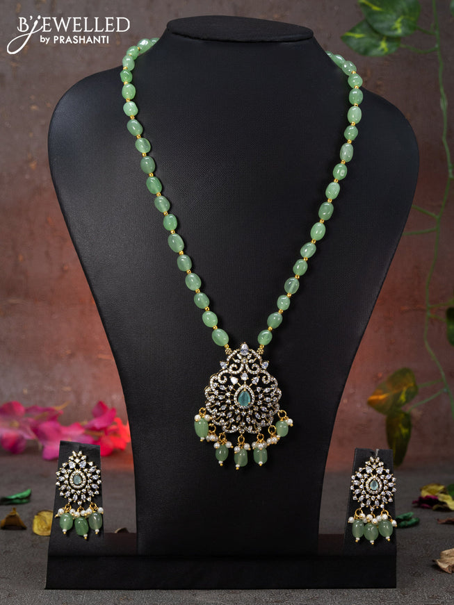 Beaded mint green necklace with cz stones and beads hanging in victorian finish
