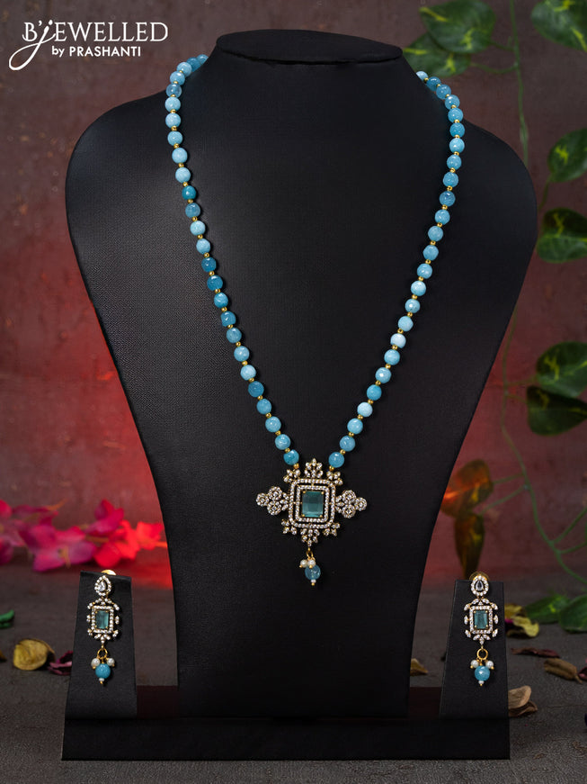 Beaded blue necklace with ice blue & cz stones and beads hanging in victorian finish