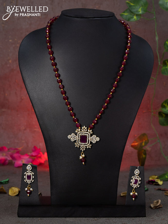 Beaded maroon necklace with pink kemp & cz stones and beads hanging in victorian finish