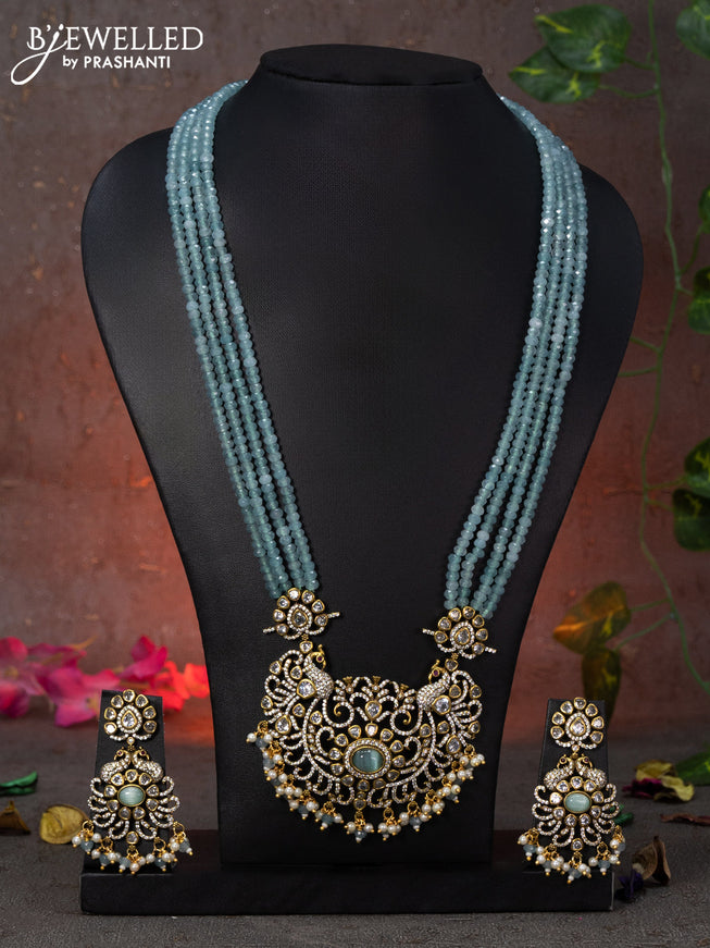 Beaded multi layer mint green necklace peacock design with cz stones and beads hanging in victorian finish