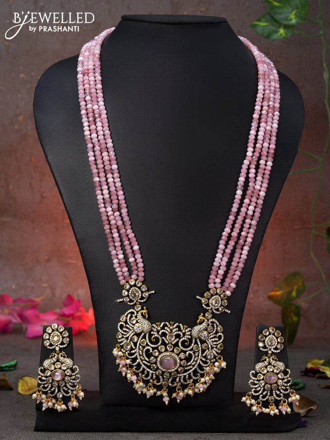 Beaded multi layer baby pink necklace peacock design with cz stones and beads hanging in victorian finish
