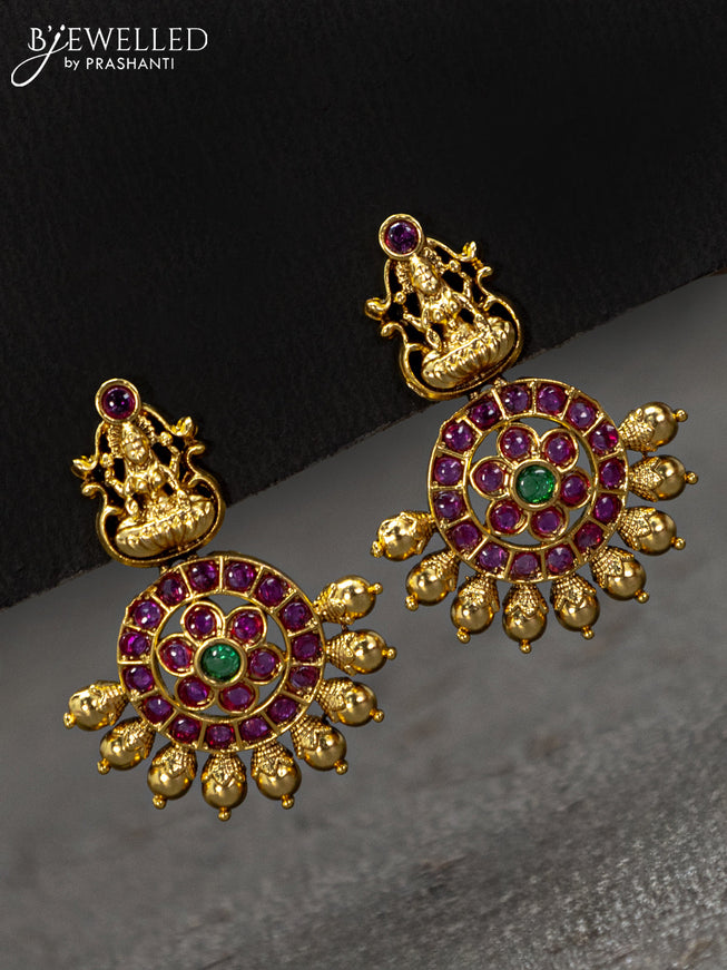 Antique earrings lakshmi design with kemp stones and golden beads