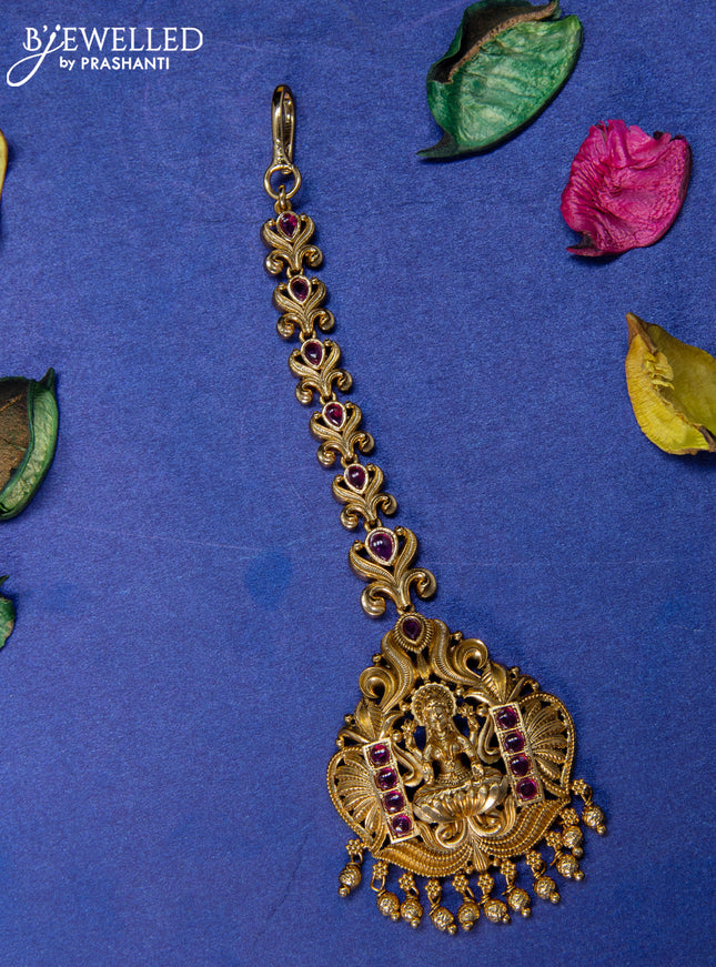 Antique maang tikka lakshmi design with pink kemp stones and golden beads hangings