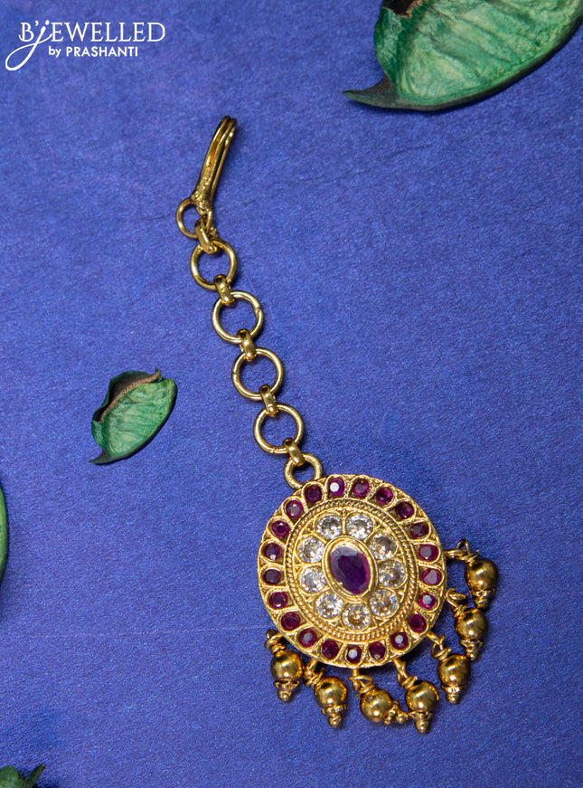 Antique maang tikka with pink kemp & cz stones and golden beads hangings