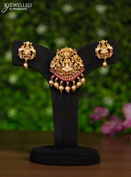 Antique pendant set lakshmi design with pink kemp stones and golden beads hanging