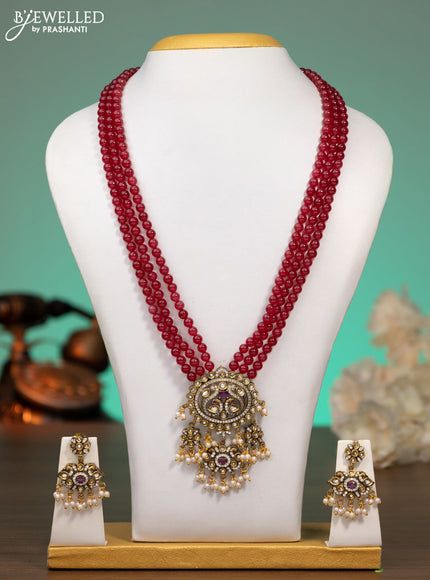 Beaded maroon necklace with ruby & cz stones and beads hanging in victorian finish