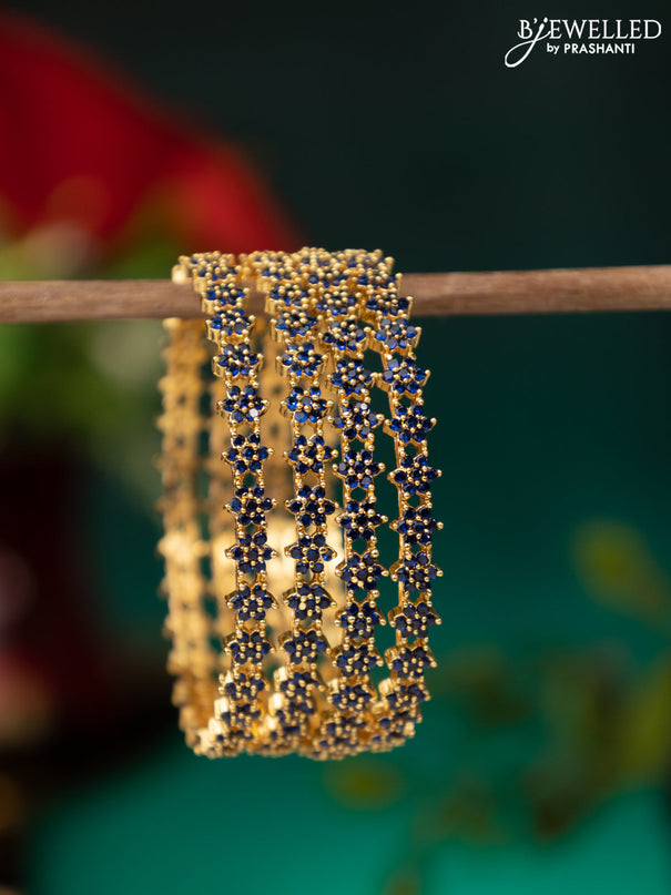 Zircon bangle with sapphire stones in gold finish