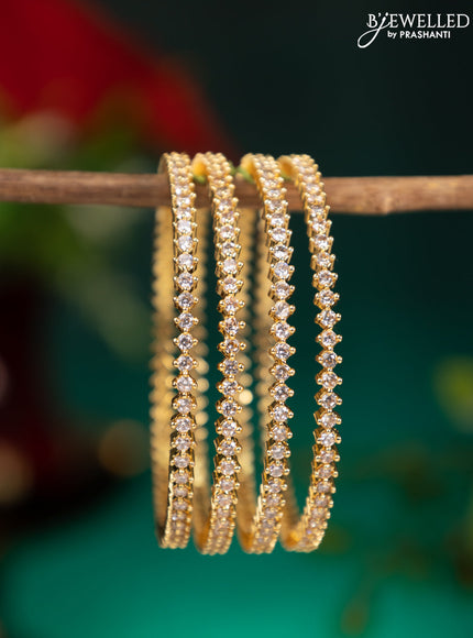 Zircon bangle with cz stones in gold finish