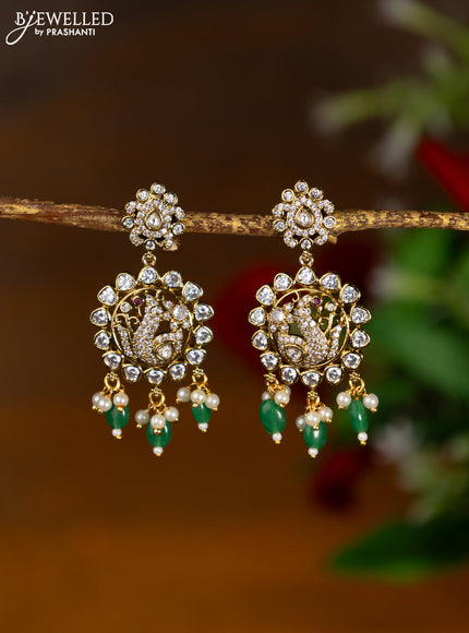 Victorian finish earrings peacock design with cz & kundan stones and green beads hanging