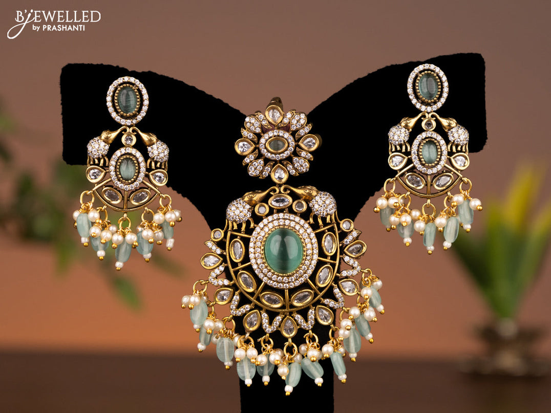 Victorian finish pendant set elephant design with mint green & cz stones and beads hanging