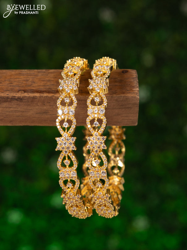 Zircon bangles with cz stones in gold finish