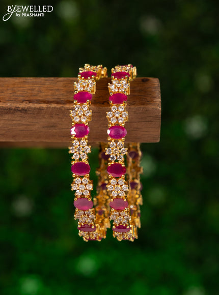 Zircon bangles with ruby and cz stones in gold finish