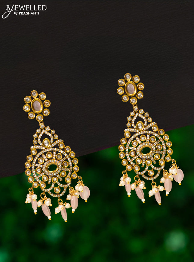 Earrings with baby pink & cz stones and beads hanging in victorian finish