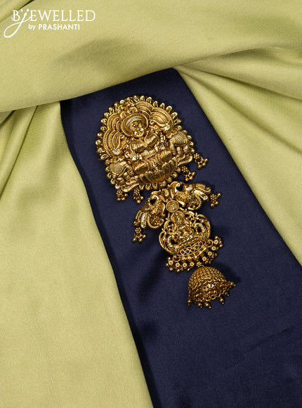 Antique jada billai lakshmi design with kemp stones and golden beads hanging