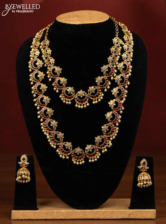 Antique bridal set chandbali design with pink kemp & cz stones and pearl hangings