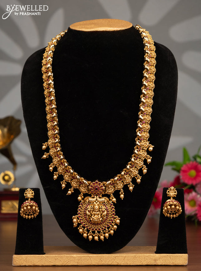Antique haaram lakshmi design with pink kemp stones and golden beads hanging