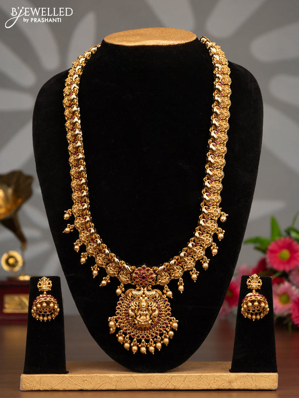 Antique haaram lakshmi design with pink kemp stones and golden beads hanging