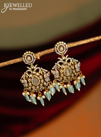 Victorian finish earrings with mint green & cz stones and beads hanging