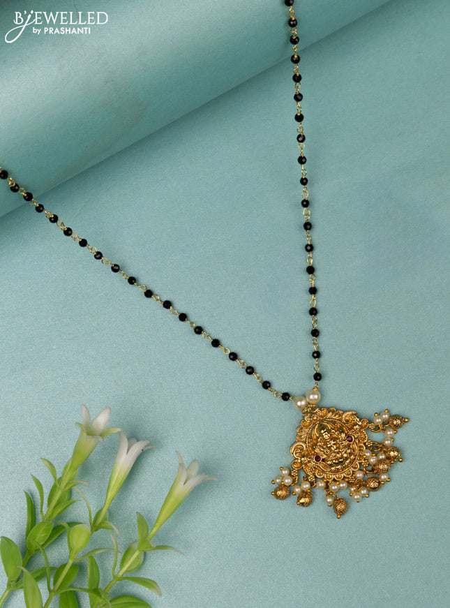 Mangalsutra lakshmi design with ruby stone and golden beads hanging without earrings