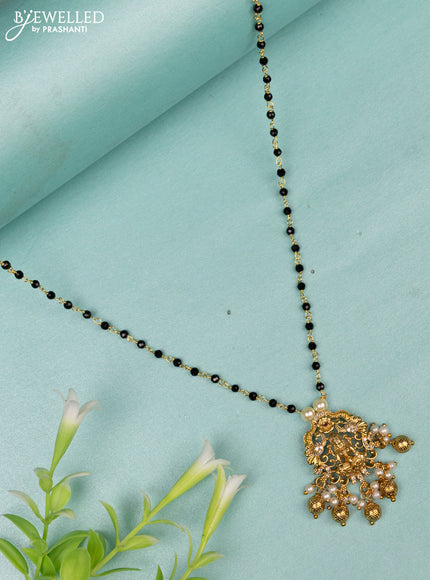 Mangalsutra lakshmi design with cz stones and golden beads hanging without earrings