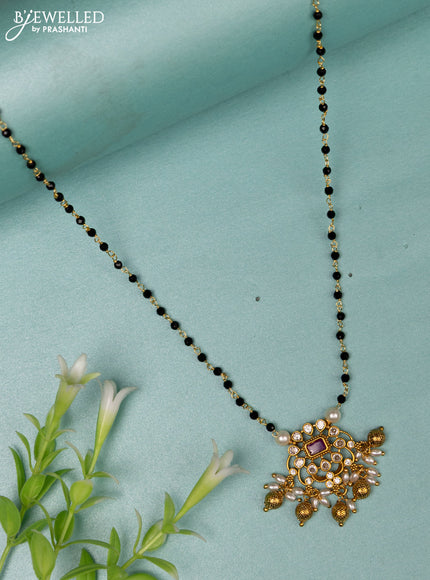 Mangalsutra with ruby & cz stones and golden beads hanging without earrings