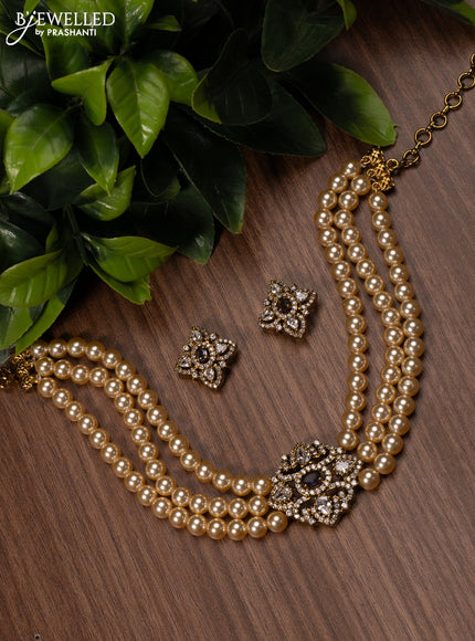 Pearl choker with violet and cz stones