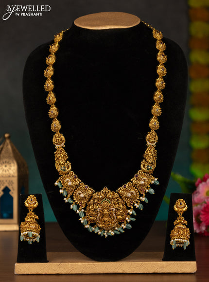 Antique haaram lakshmi design with kemp & cz stones and mint green beads hanging
