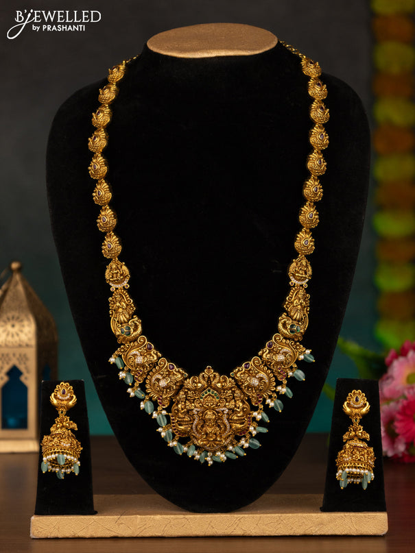 Antique haaram lakshmi design with kemp & cz stones and mint green beads hanging
