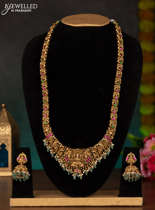 Antique haaram lakshmi design with kemp stones and mint green beads hanging