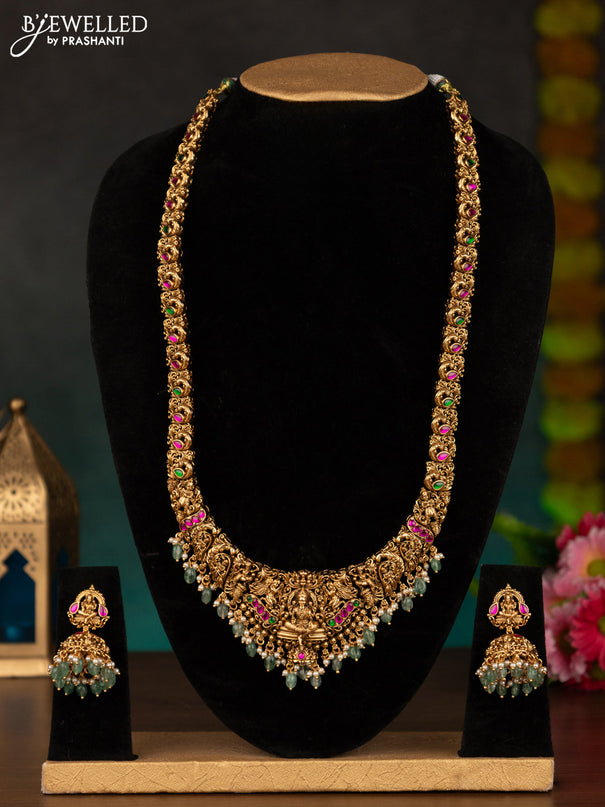 Antique haaram lakshmi design with kemp stones and mint green beads hanging