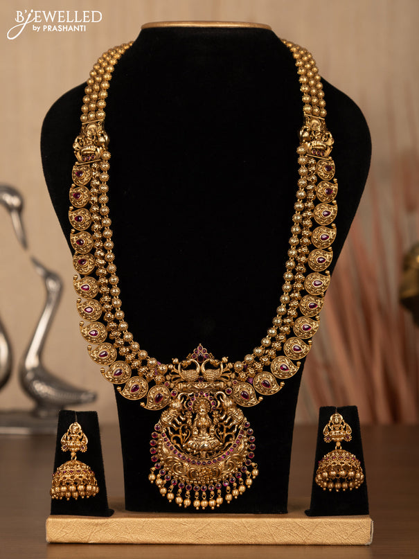 Antique haaram lakshmi design with pink kemp stones and golden beads hanging