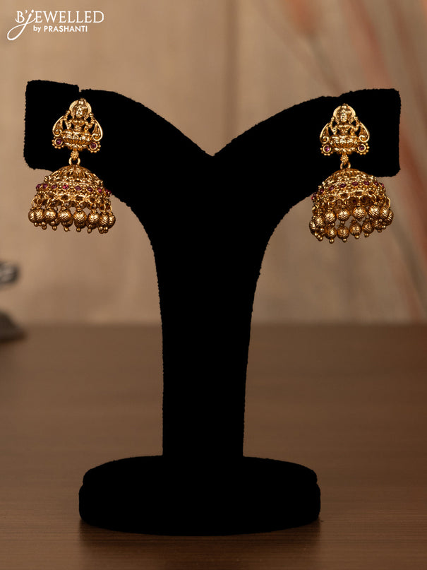 Antique haaram lakshmi design with pink kemp stones and golden beads hanging