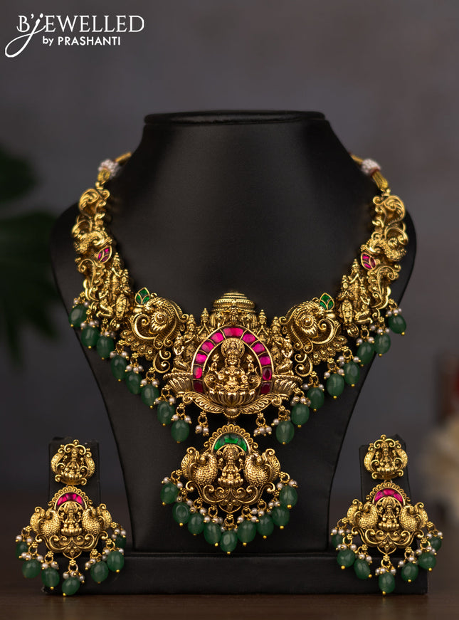 Antique necklace lakshmi design with jadau stones and green beads hanging