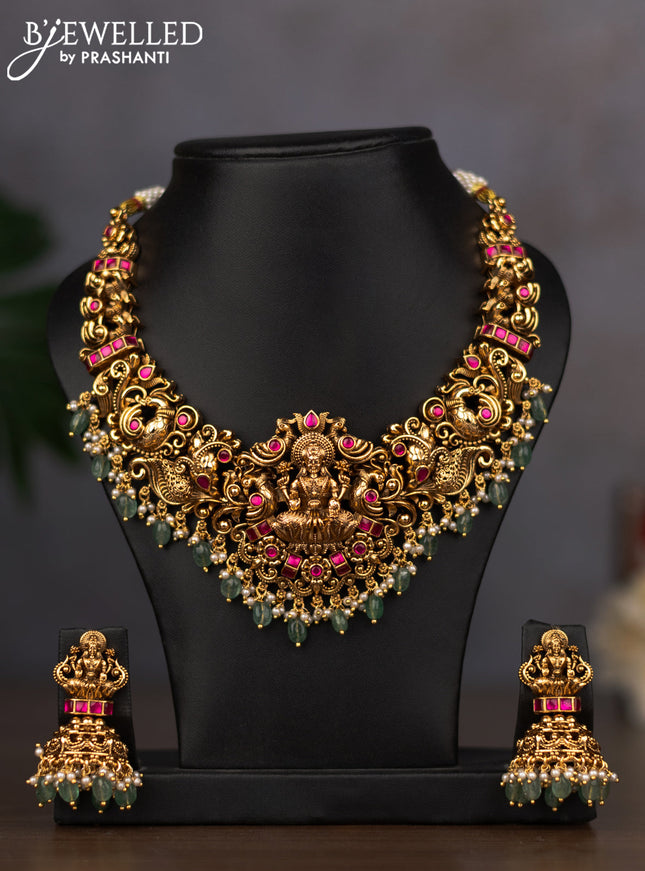 Antique necklace lakshmi design with pink jadau stones and green beads hanging