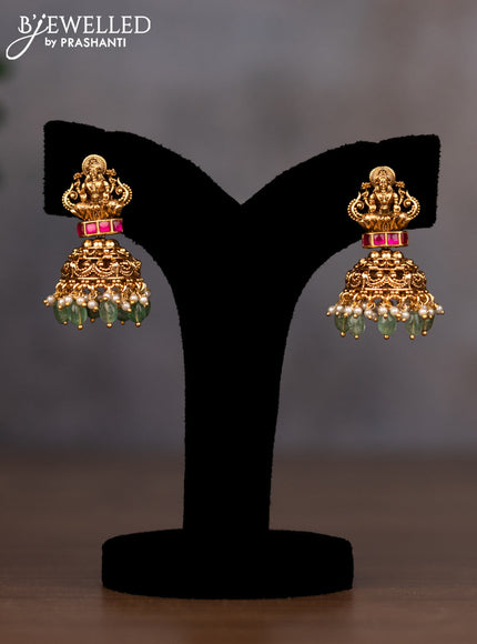 Antique necklace lakshmi design with pink jadau stones and green beads hanging