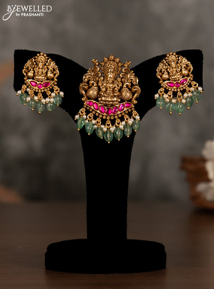 Antique pendant set lakshmi design with pink kemp stones and green beads hanging