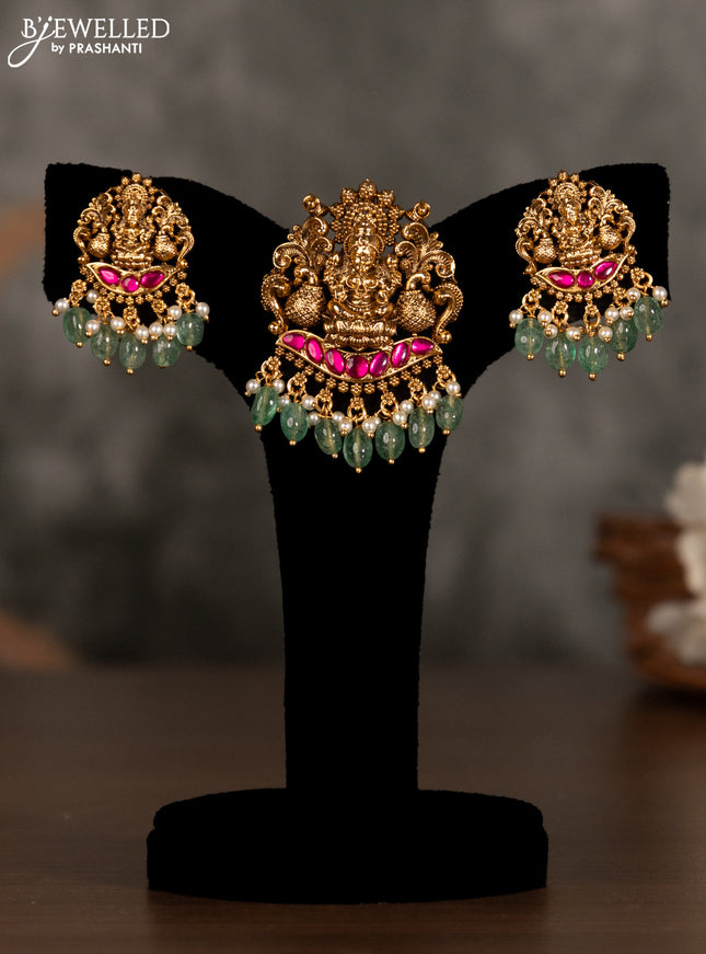 Antique pendant set lakshmi design with pink kemp stones and green beads hanging