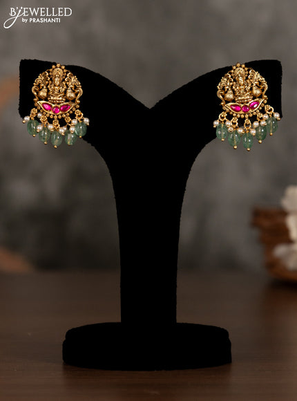 Antique pendant set lakshmi design with pink kemp stones and green beads hanging
