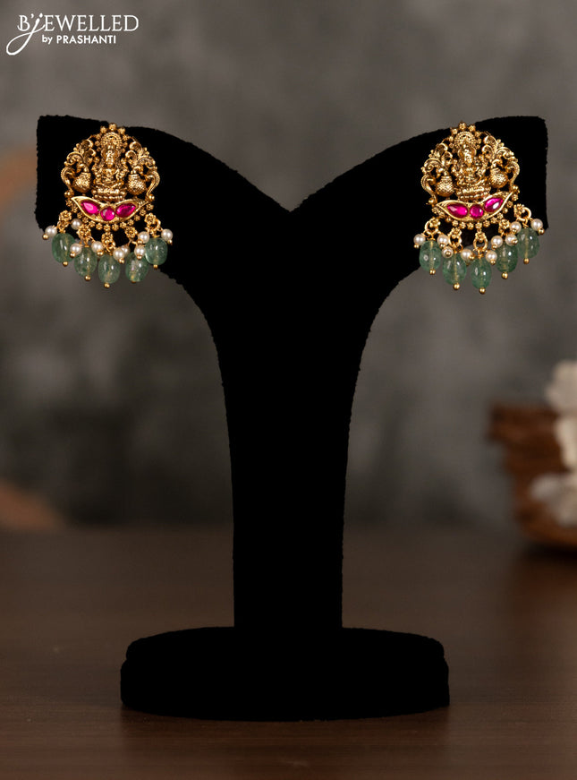 Antique pendant set lakshmi design with pink kemp stones and green beads hanging