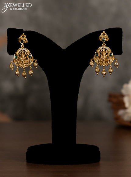 Antique pendant set lakshmi design with green kemp & cz stones and golden beads hanging