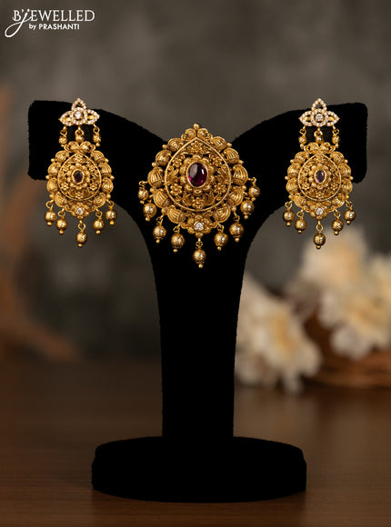 Antique pendant set with pink kemp & cz stones and golden beads hanging