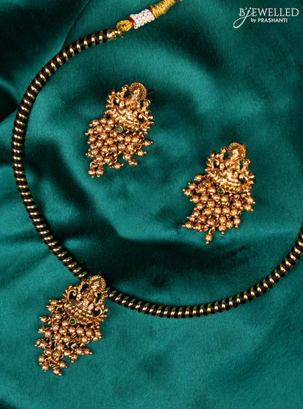 Antique ring type choker green kemp stone with lakshmi pendant and golden beads hanging