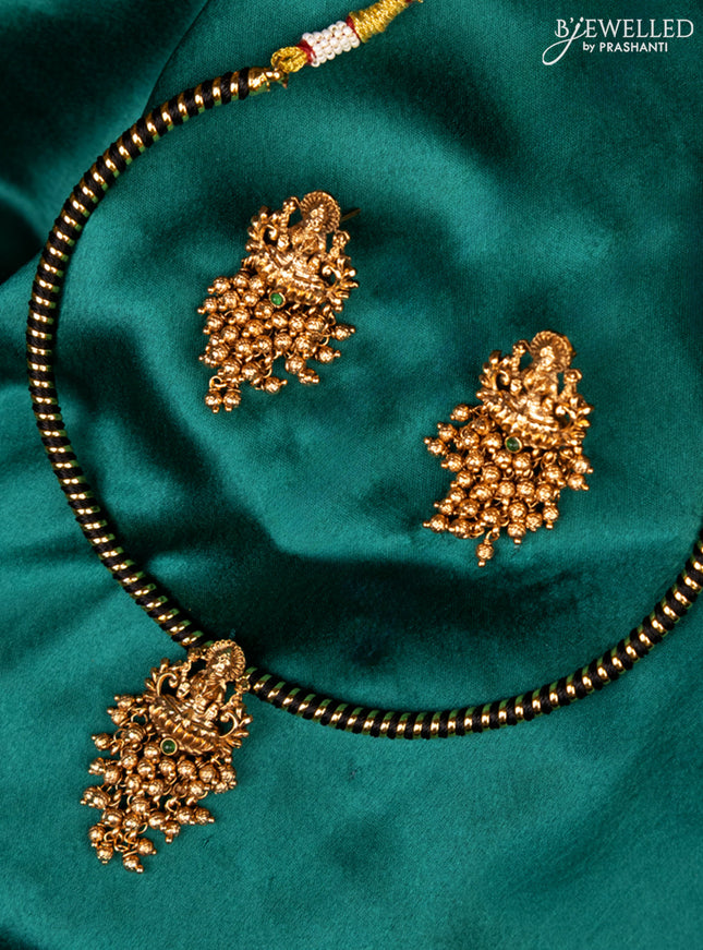 Antique ring type choker green kemp stone with lakshmi pendant and golden beads hanging