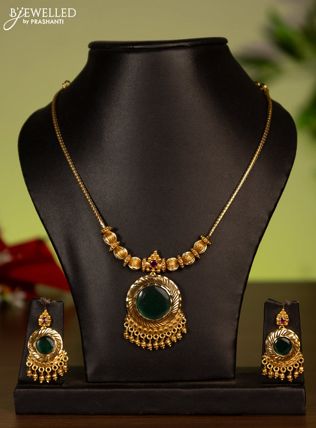 Antique attigai necklace with kemp stones and golden beads hanging
