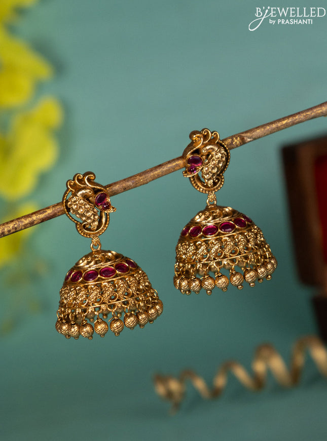 Antique jhumka with pink kemp stones and golden beads hanging