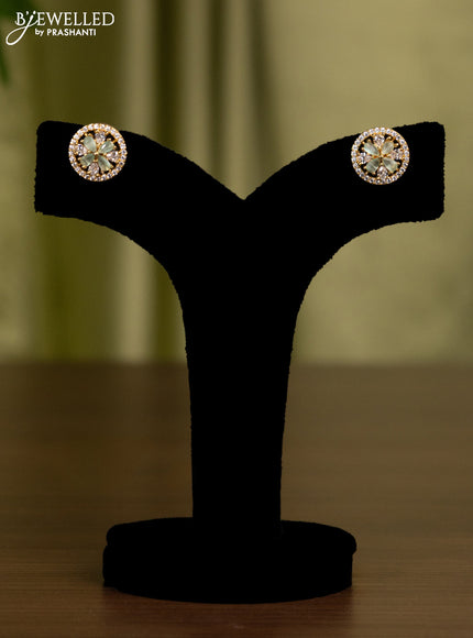 Zircon earrings with mint green and cz stones in gold finish