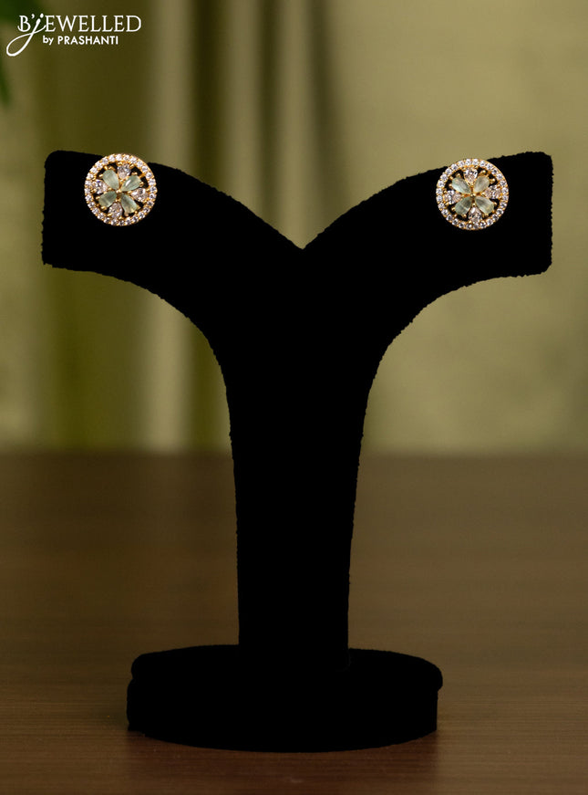 Zircon earrings with mint green and cz stones in gold finish