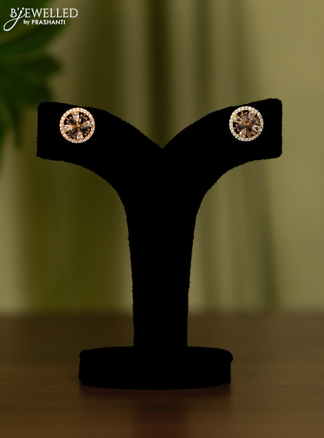 Zircon earrings with violet and cz stones in gold finish